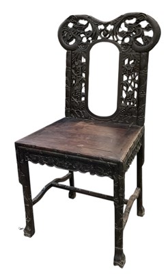 Lot 1057 - A 19th century Chinese carved hardwood...