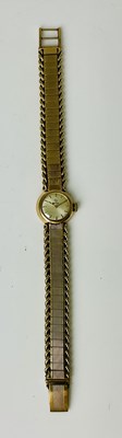 Lot 1103 - CYMA; a lady's vintage 9ct gold wristwatch,...