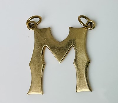 Lot 611 - A 9ct yellow gold pendant in the form of the...