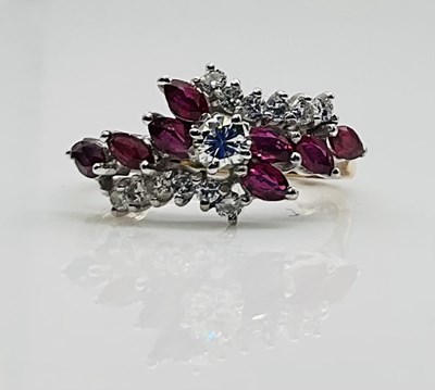 Lot 629 - A 9ct yellow gold ruby set dress ring, size k...