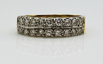Lot 652 - An 18ct yellow gold diamond two row half...