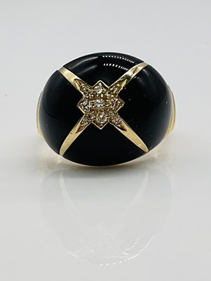 Lot 703 - A 14ct yellow gold diamond set and black onyx...