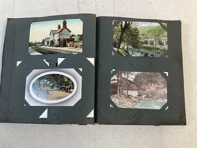 Lot 2100 - Two postcard albums comprising approximately...