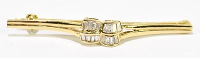 Lot 1412 - A yellow metal diamond set brooch formed of...
