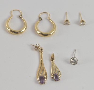 Lot 1173 - A pair of 9ct yellow gold hoop earrings, a...