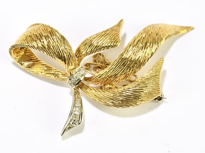 Lot 1413 - An 18ct yellow gold and tiny diamond set bow...