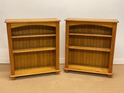 Lot 2816 - A pair of pine open book cases with two...