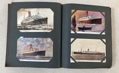 Lot 2097 - A postcard album comprising approximately one...