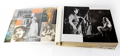 Lot 587 - An album containing colour and black and white...