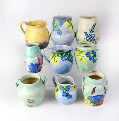 Lot 395 - E. RADFORD; nine 1930s vases and jugs hand...