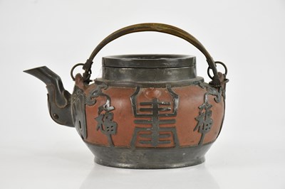 Lot 1597 - A Chinese Yixing teapot with pewter applied...