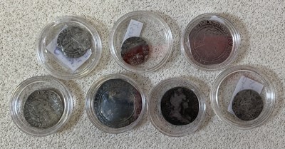 Lot 1173 - A collection of seven coins comprising an...