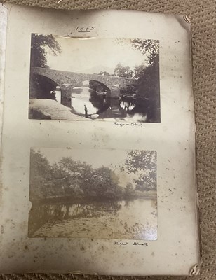 Lot 2110 - A late 19th century photograph album, together...