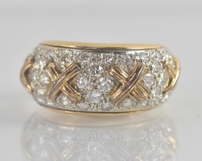 Lot 1188 - An 18ct yellow gold diamond set ring, with...