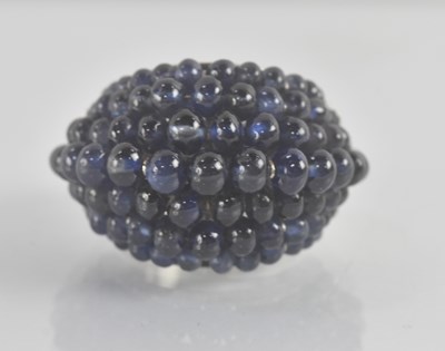 Lot 1178 - CARTIER; a white metal cabochon sapphire and...