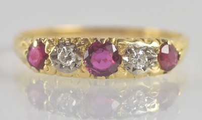 Lot 1191 - An antique yellow metal ruby and diamond five...