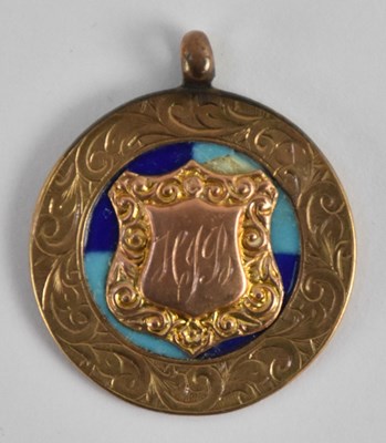Lot 1174 - A 9ct yellow gold circular prize fob, with...