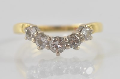 Lot 1311 - An 18ct yellow and white gold graduated five...