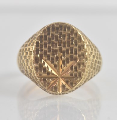 Lot 1202 - A 9ct yellow gold signet ring, with star and...