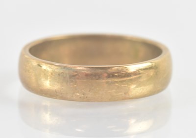Lot 1232 - A 9ct yellow gold band ring, size R, approx 4.9g.