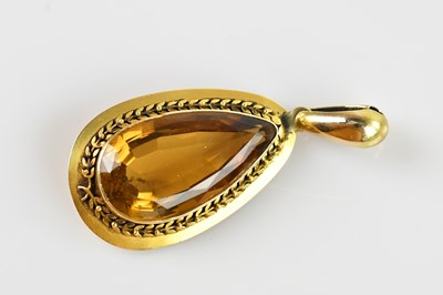 Lot 2234 - A yellow metal pendant, set with a pear shaped...