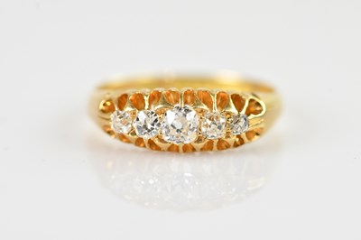 Lot 2338 - An 18ct yellow gold diamond five stone ring,...