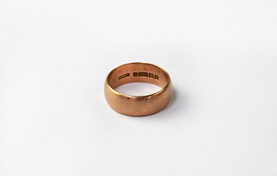 Lot 1076 - A 9ct brushed rose gold wedding band, size V,...