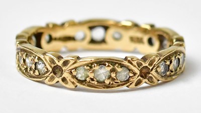 Lot 1023 - A 9ct yellow gold ring set with white stones,...