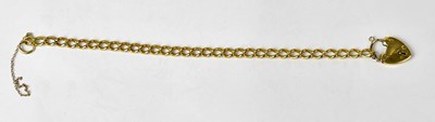 Lot 1047 - An 18ct yellow gold curb link bracelet with a...