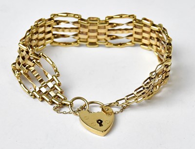 Lot 1049 - A 9ct yellow gold fancy gate link bracelet,...
