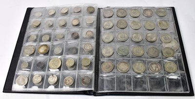 Lot 921 - A coin collectors' folder containing various...