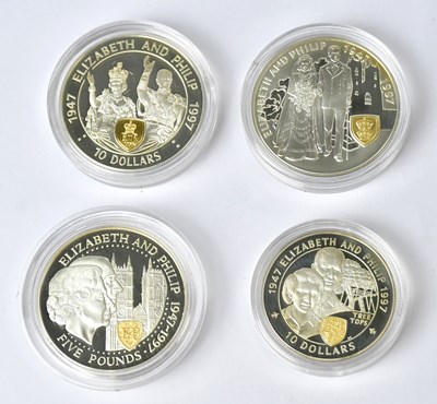 Lot 931 - Four Elizabeth II commemorative silver coins,...