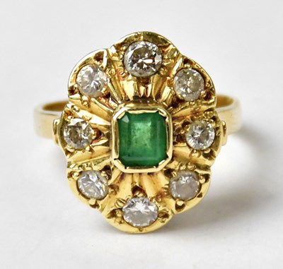Lot 1004 - An 18ct yellow gold ring set with a central...