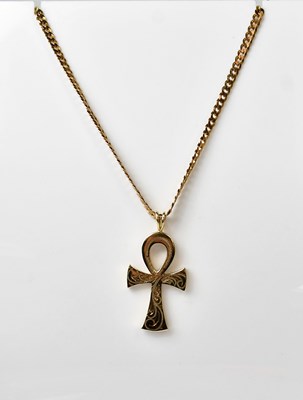 Lot 1091 - A 9ct yellow gold ankh pendant with engraved...