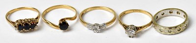 Lot 1031 - Four 9ct yellow gold rings, comprising a...