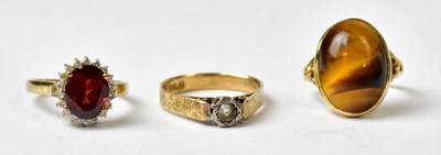 Lot 1030 - Three 9ct yellow gold rings, comprising one...