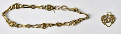 Lot 1050 - A 9ct yellow gold fancy link bracelet, length...