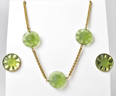 Lot 1128 - LALIQUE; a gold-coloured chain necklace set...
