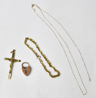 Lot 1122 - A 9ct yellow gold crucifix pendant, length...