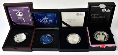 Lot 906 - Three silver-proof £5 coins, comprising...