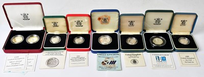 Lot 895 - ROYAL MINT; seven silver-proof coins,...