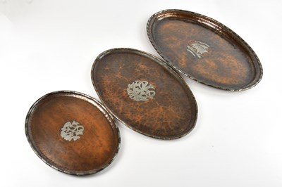 Lot 2307 - HUGH WALLIS; two copper and pewter oval trays,...