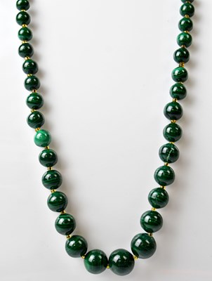 Lot 1110 - A malachite graduated beaded necklace, with...