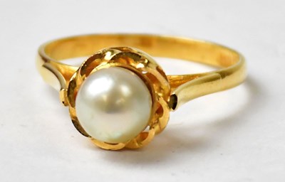 Lot 993 - A 21ct yellow gold ring set with a pearl, size...