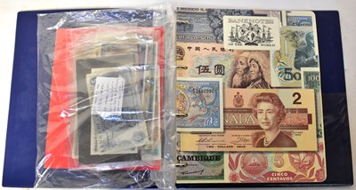 Lot 986 - A Banknotes of the World folder together with...
