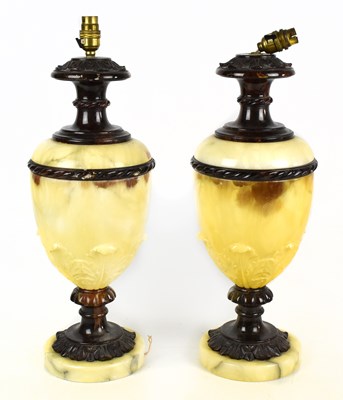 Lot 1527 - A pair of of decorative alabaster and bronzed metal table lamps with moulded floral decoration