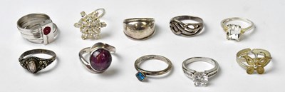 Lot 1039 - Ten 925 silver rings, to include a floral...