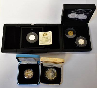 Lot 932 - Four silver coins, comprising a silver-proof...