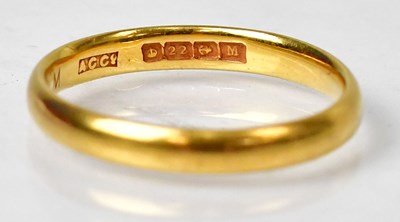 Lot 992 - A 22ct yellow gold wedding band, size O,...