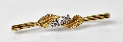 Lot 1072 - A 9ct yellow gold bar brooch set with three...
